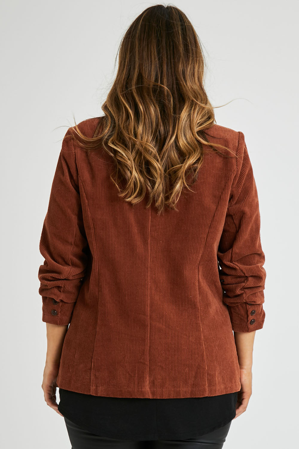 Model Laura wearing size 14 of the Feeling Good Cord Blazer in colour Rust, from the back