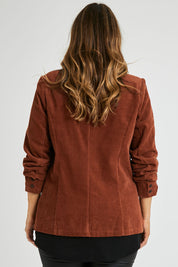 Model Laura wearing size 14 of the Feeling Good Cord Blazer in colour Rust, from the back