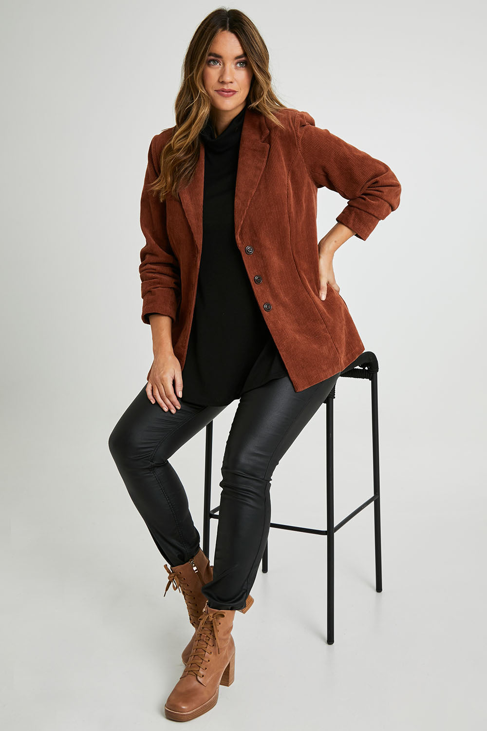 Model Laura wearing size 14 of the Feeling Good Cord Blazer in colour Rust, from the front, showing the whole outfit