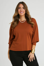 Model Laura wearing size 14 of the Ive Got This Top in colour Toffee, from the front, cropped image