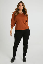 Model Laura wearing size 14 of the Ive Got This Top in colour Toffee, from the front, showing the whole outfit