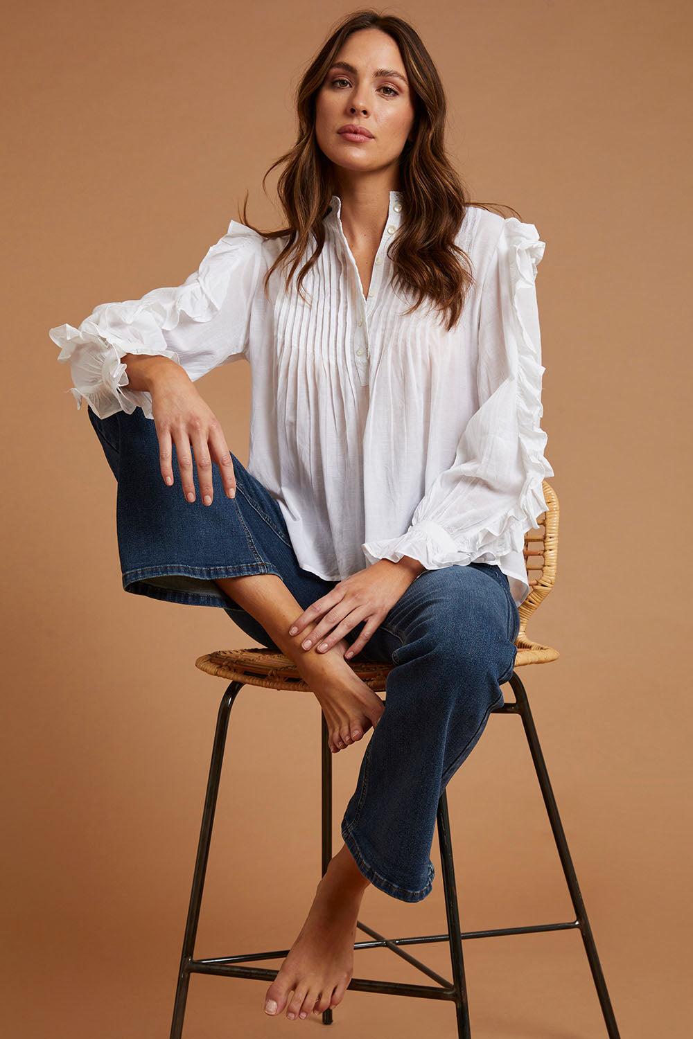 Model Madeline wearing size 10 of the Ruffled Feathers Blouse in colour White (White), from the front, showing the whole outfit