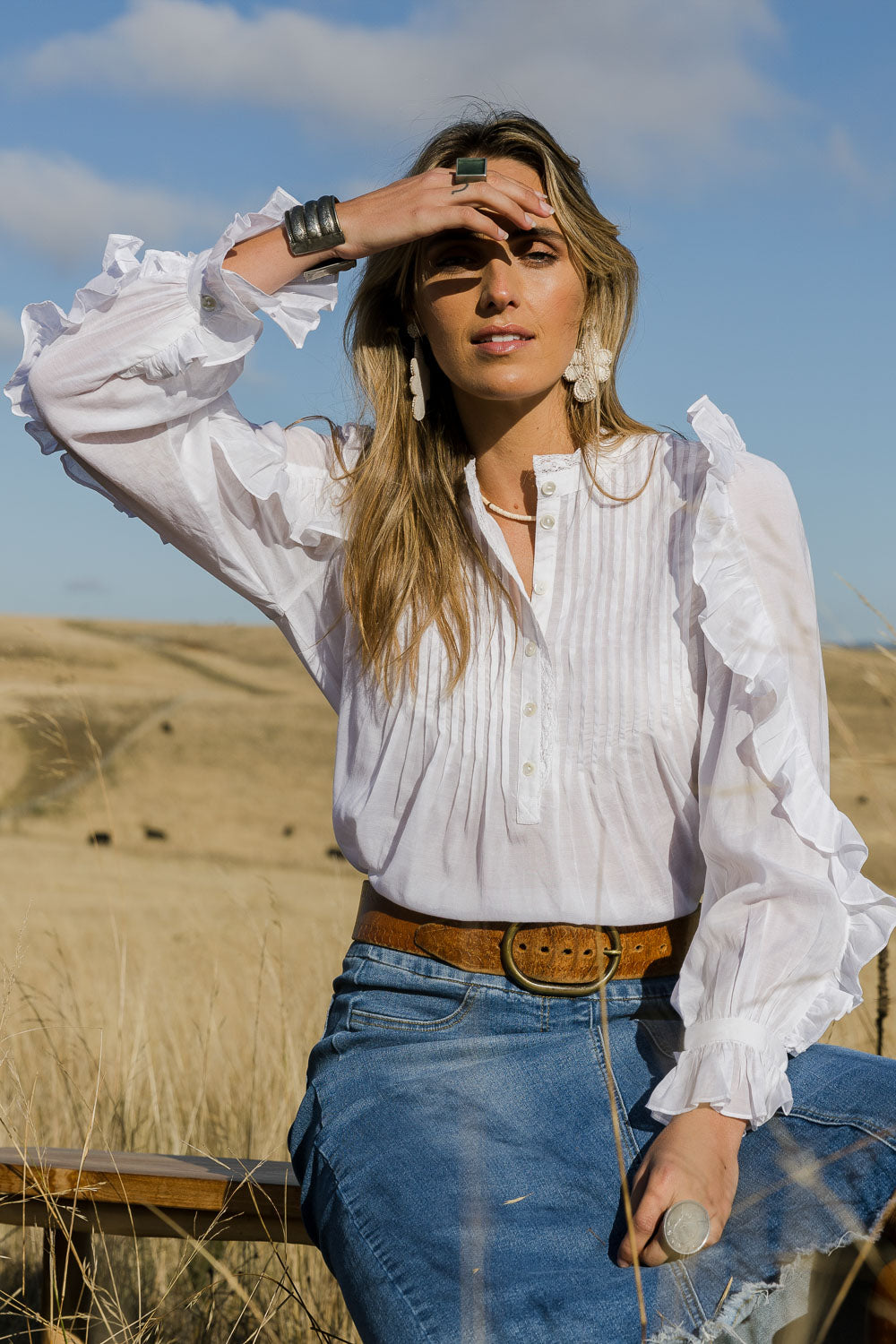 Model Tegan wearing size 10 of the Ruffled Feathers Blouse in colour White (White), from the front, showing the whole outfit