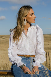 Model Tegan wearing size 10 of the Ruffled Feathers Blouse in colour White (White), from the front, showing the whole outfit