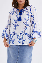 Model Monique wearing size 14 of the Feel My Vibe Embroidered Blouse in colour Whiteblue (White), from the front, cropped image