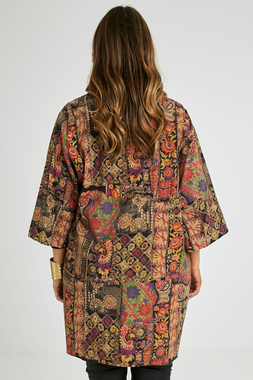 Model Laura wearing size 14 of the You Colour My World Long Kimono in colour Patchprint (Black), from the back