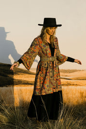 Model Tegan wearing size 10 of the You Colour My World Long Kimono in colour Patchprint (Black), from the front, showing the whole outfit