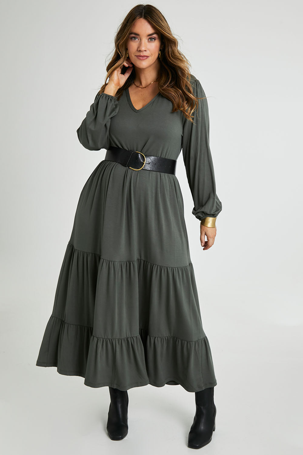Model Laura wearing size 14 of the Tiered Delight Bamboo Dress in colour Combat (Green), from the front, showing the whole outfit