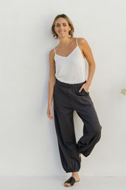 Model Tegan wearing size 10 of the Keeping It Cool Boyfriend Pants in colour Castle (Grey), from the front, showing the whole outfit