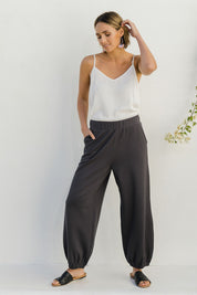 Model Tegan wearing size 10 of the Keeping It Cool Boyfriend Pants in colour Castle (Grey), from the front, showing the whole outfit