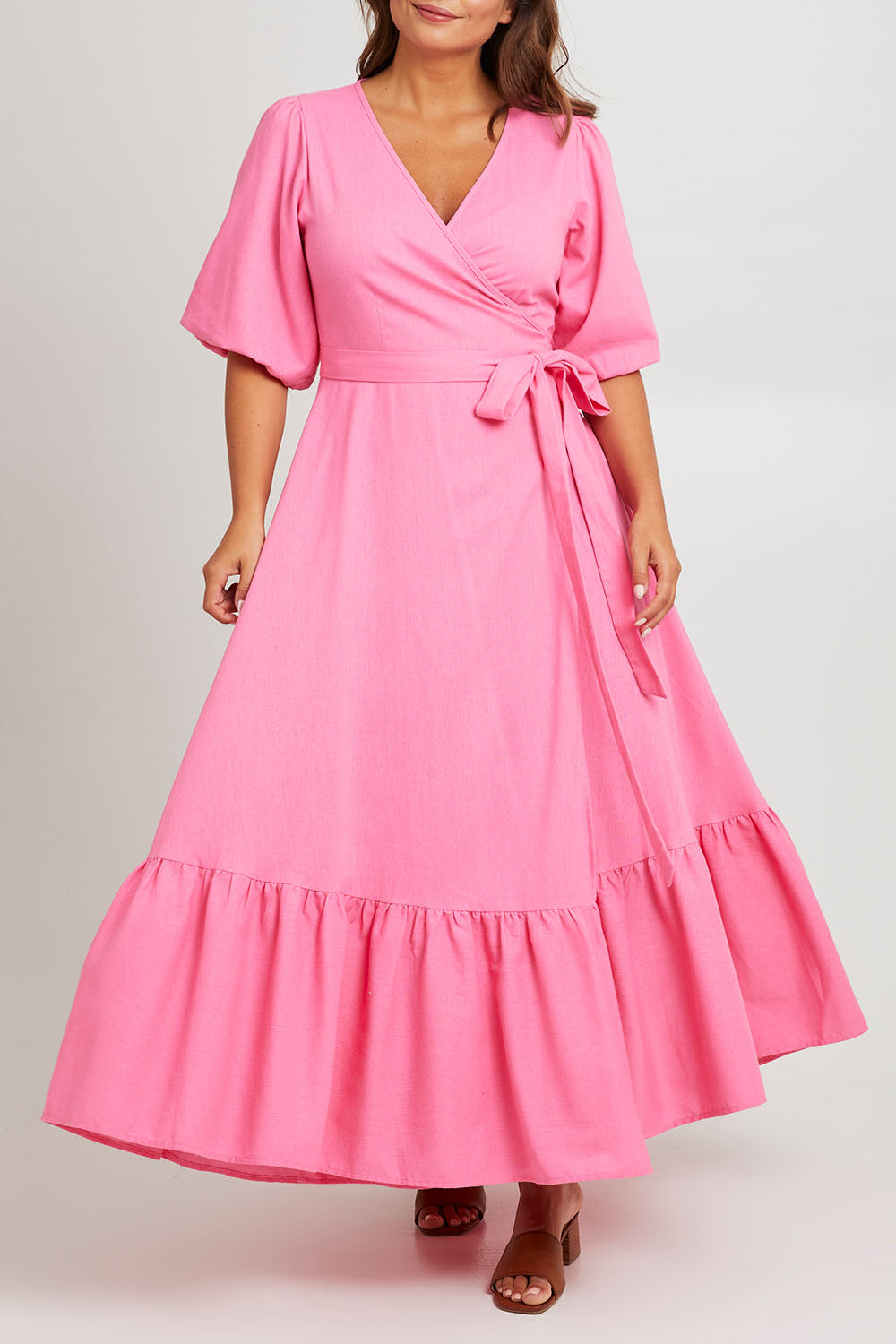 Model Monique wearing size 14 of the La Dolce Vita Puff Sleeve Dress in colour Bubblegum (Pink), from the front, cropped image