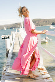 Model Phoebe wearing size 10 of the La Dolce Vita Puff Sleeve Dress in colour Bubblegum (Pink), from the front, showing the whole outfit