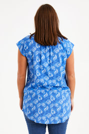 Model Monique wearing size 14 of the Forget Me Not Sleeveless Blouse in colour Bluewhite (Blue), from the back