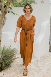 Model Tegan wearing size 10 of the Casual Friday Dress in colour Rust, from the front, showing the whole outfit