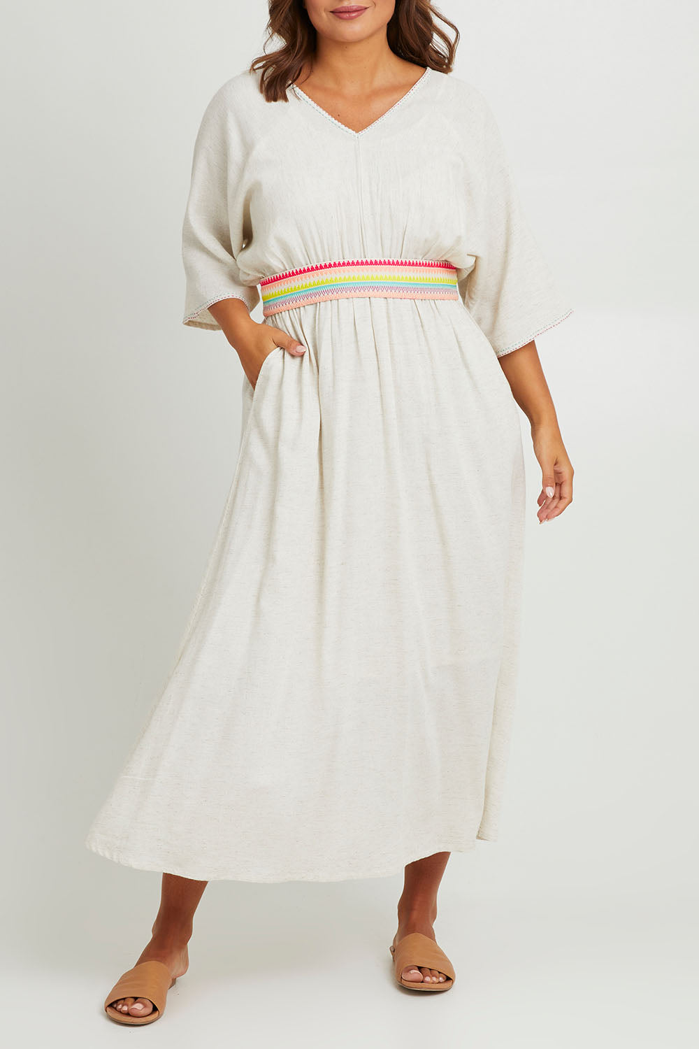 Model Monique wearing size 14 of the Daydream Cotton Kaftan Dress in colour Wheat, from the front, cropped image