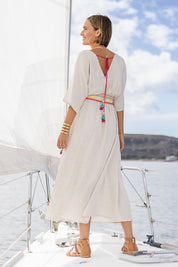 Model Tegan wearing size 10 of the Daydream Cotton Kaftan Dress in colour Wheat, from the back