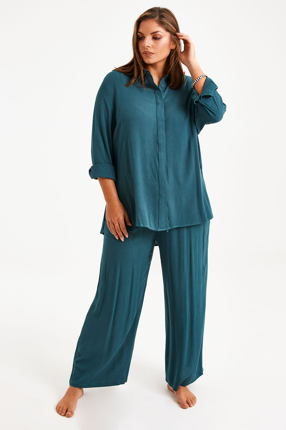 Model Monique wearing size 14 of the Brunch Lunch And Dinner Pants in colour Sage (Green), from the front, showing the whole outfit