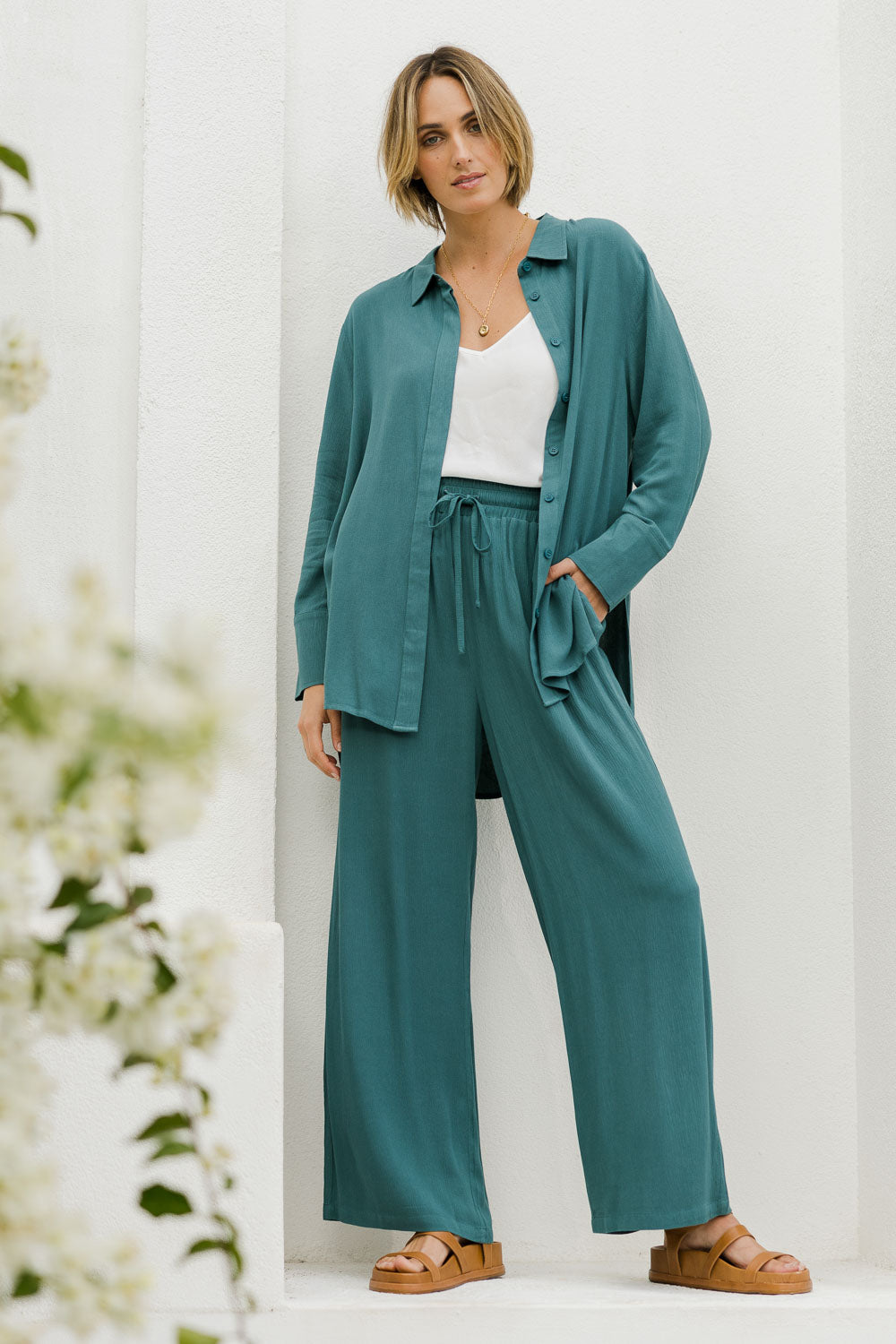 Model Tegan wearing size 10 of the Brunch Lunch And Dinner Pants in colour Sage (Green), from the front, showing the whole outfit