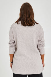 Model Monique wearing size 14 of the Easy Vibes Ribbed Top in colour Natural, from the back