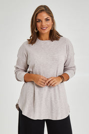 Model Monique wearing size 14 of the Easy Vibes Ribbed Top in colour Natural, from the front, cropped image