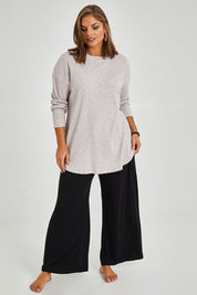 Model Monique wearing size 14 of the Easy Vibes Ribbed Top in colour Natural, from the front, showing the whole outfit