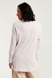 Model Natalie wearing size 8 of the Easy Vibes Ribbed Top in colour Natural, from the back