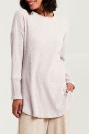 Model Natalie wearing size 8 of the Easy Vibes Ribbed Top in colour Natural, from the front, cropped image