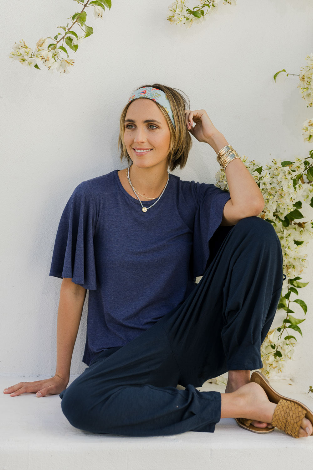 Model Tegan wearing size 8 of the Flutter By Tee in colour Marldenim (Blue), from the front, showing the whole outfit