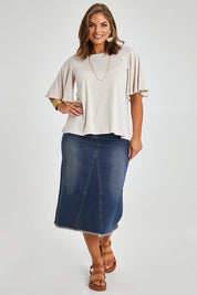 Model Monique wearing size 14 of the Flutter By Tee in colour Natural, from the front, showing the whole outfit