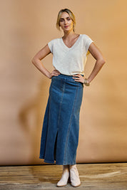 Model Tegan wearing size 10 of the Easy As Pull On Panel Skirt in colour Darkdenim (Blue), from the front, showing the whole outfit
