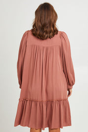 Model Monique wearing size 14 of the Ready For Any Adventure Dress in colour Cinnamon (Red), from the back