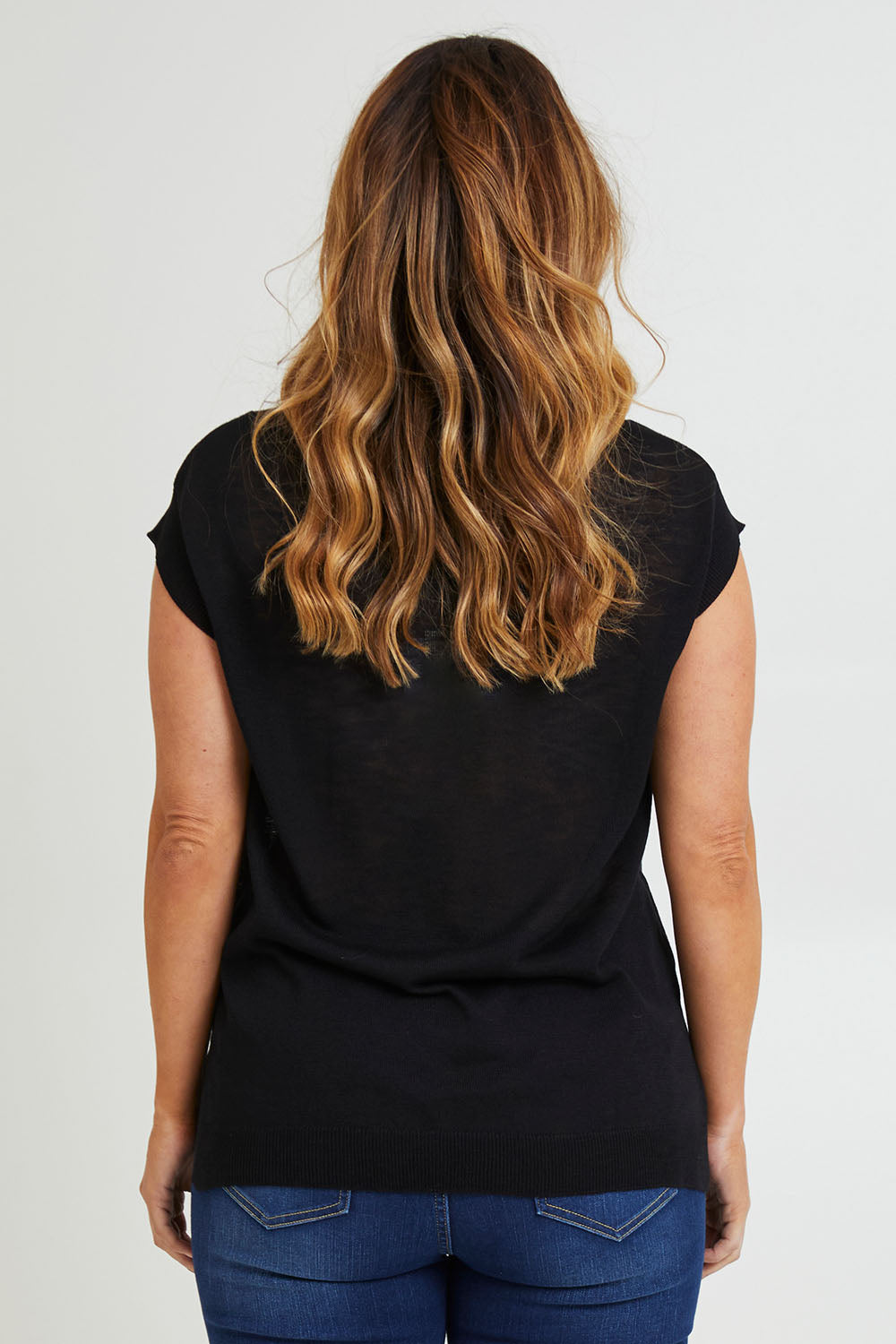 Model Laura wearing size L of the Go To Knit Tank in colour Black (Black), from the back