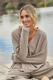 Model Tegan wearing size S of the My Boyfriends Wool Cashmere Cardi in colour Stone, from the front, showing the whole outfit