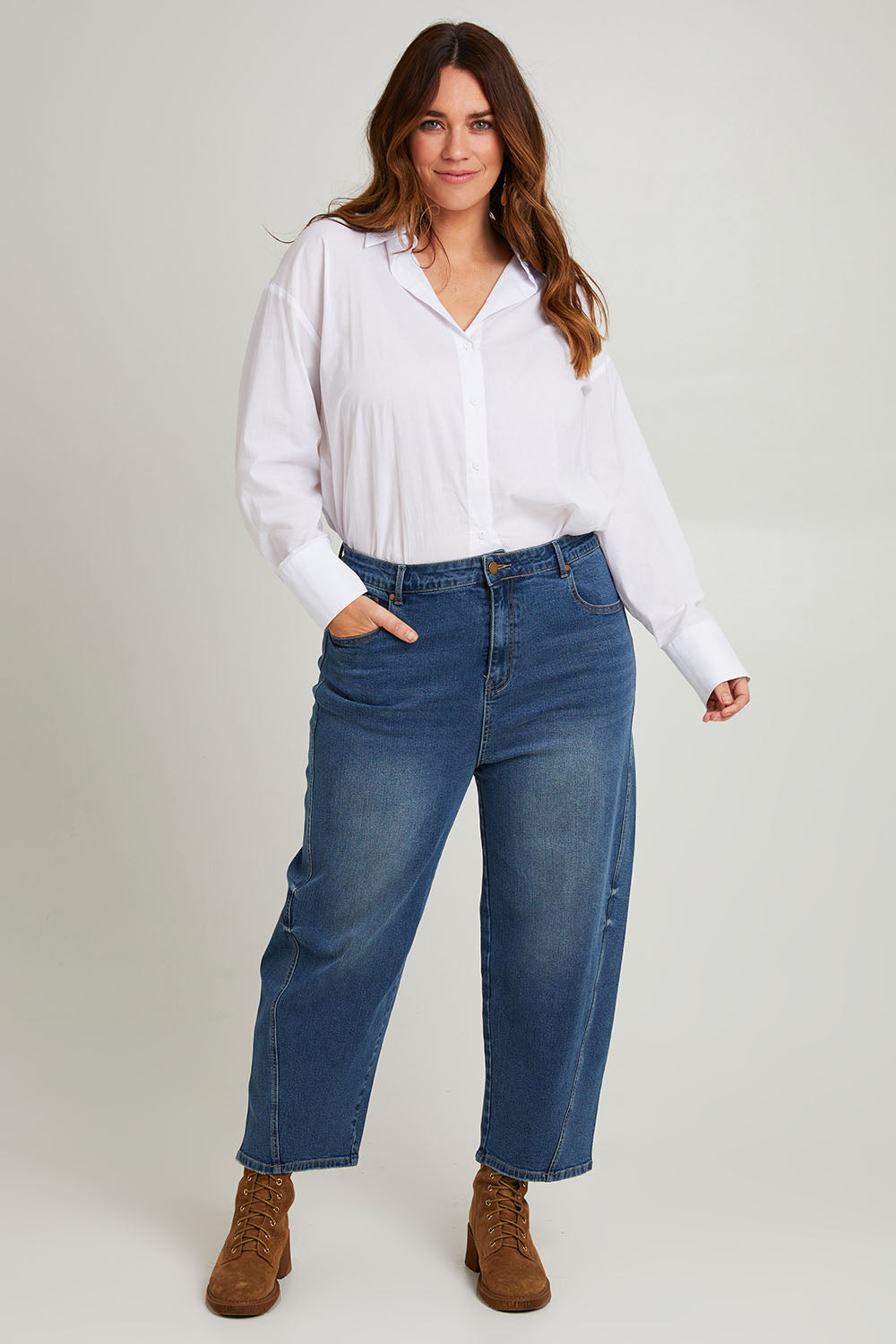 Model Laura wearing size 14 of the For All The Days Jeans in colour Denim (Blue), from the front, showing the whole outfit