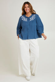 Model Laura wearing size 14 of the First Light Cotton Blouse in colour Dutchblue (Blue), from the front, showing the whole outfit