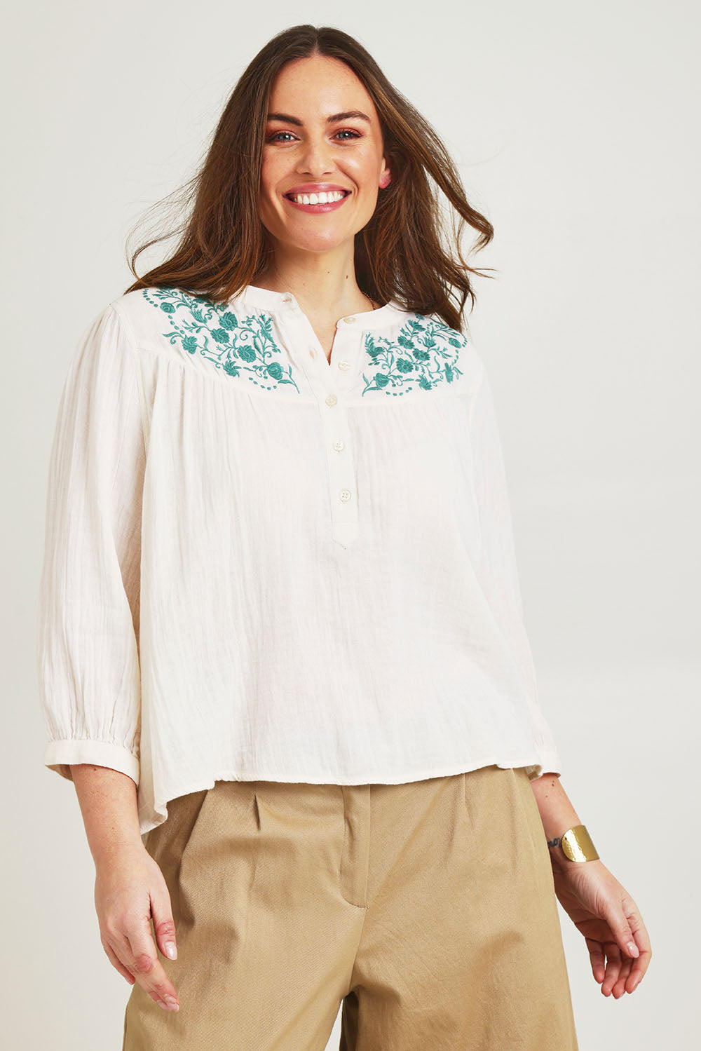Model Jane wearing size 14 of the First Light Cotton Blouse in colour Milk (White), from the front, cropped image