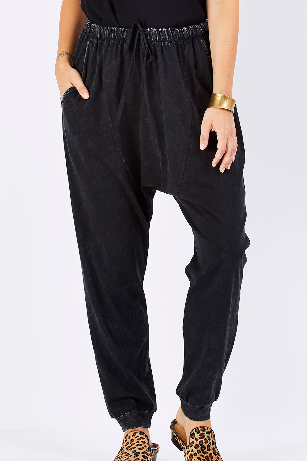 Model Georgia wearing size 10 of the Hunt And Gather Pants in colour Black (Black), from the front, cropped image