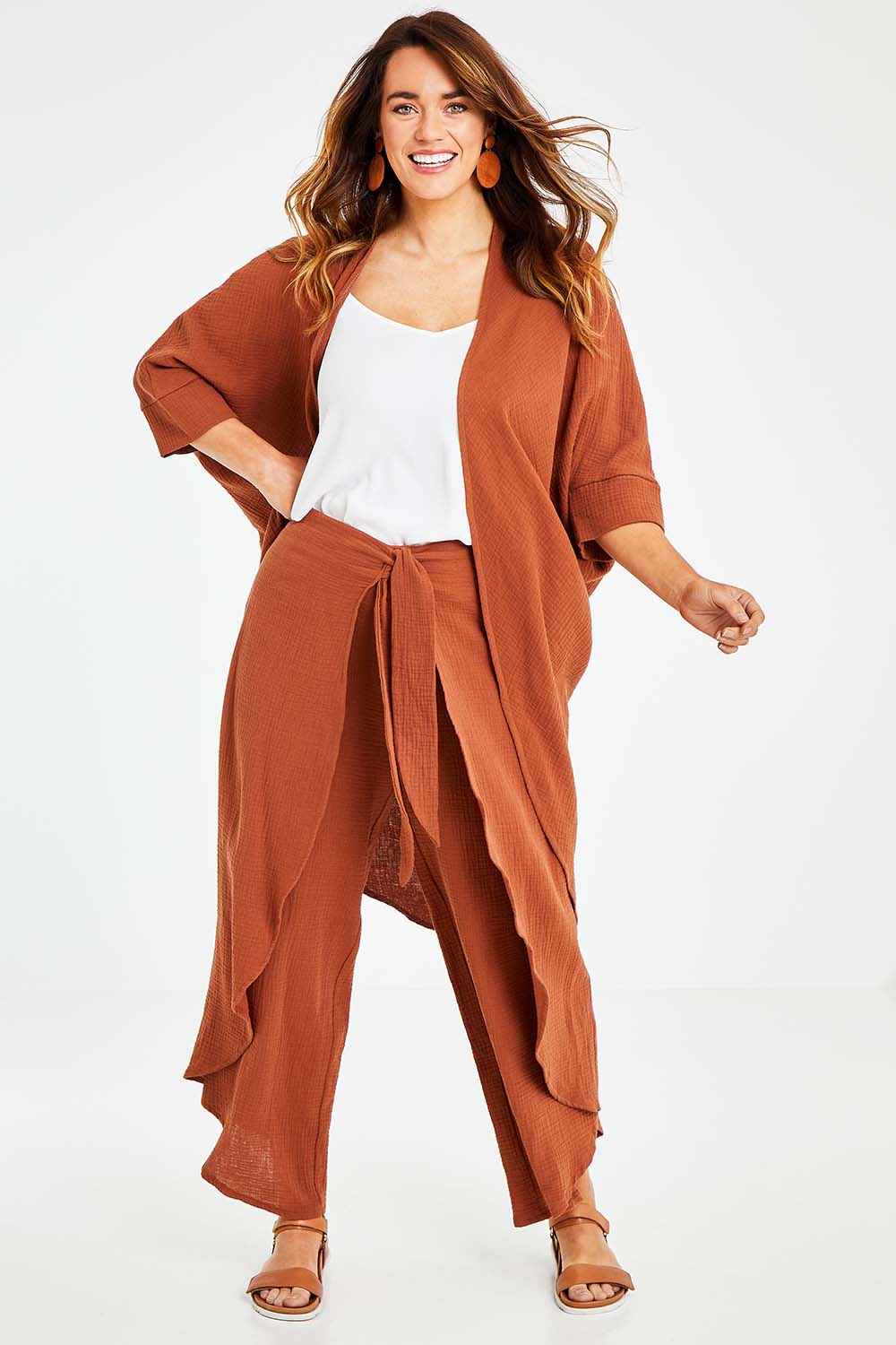 Model Laura wearing size 14 of the Falling For You Cotton Cardi in colour Cinnamon, from the front, showing the whole outfit