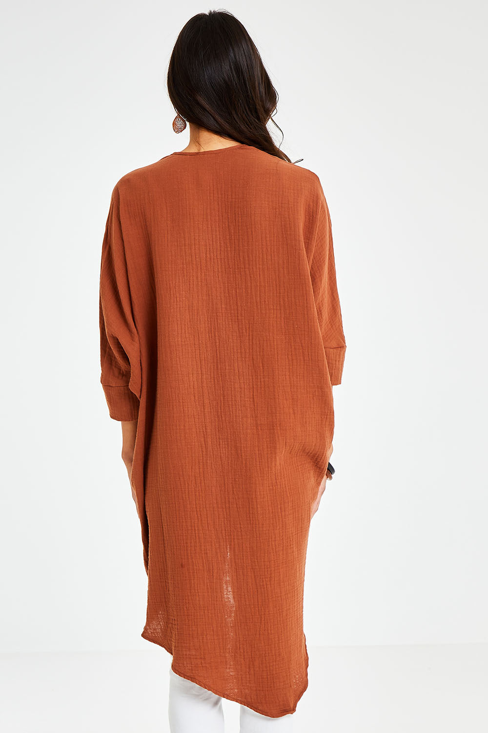 Model Vitoria wearing size 10 of the Falling For You Cotton Cardi in colour Cinnamon, from the back