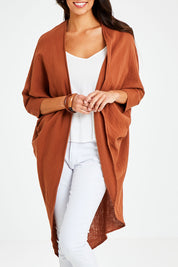 Model Vitoria wearing size 10 of the Falling For You Cotton Cardi in colour Cinnamon, from the front, cropped image