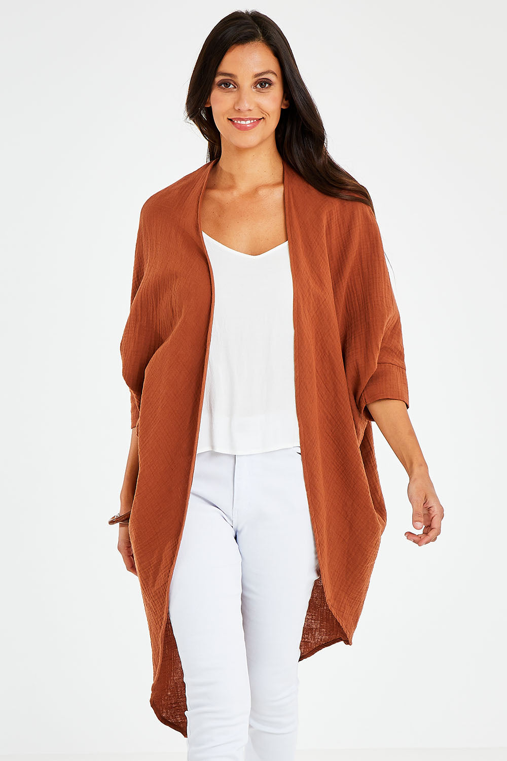 Model Vitoria wearing size 10 of the Falling For You Cotton Cardi in colour Cinnamon, from the front, cropped image