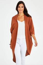 Model Vitoria wearing size 10 of the Falling For You Cotton Cardi in colour Cinnamon, from the front, cropped image
