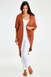 Model Vitoria wearing size 10 of the Falling For You Cotton Cardi in colour Cinnamon, from the front, showing the whole outfit
