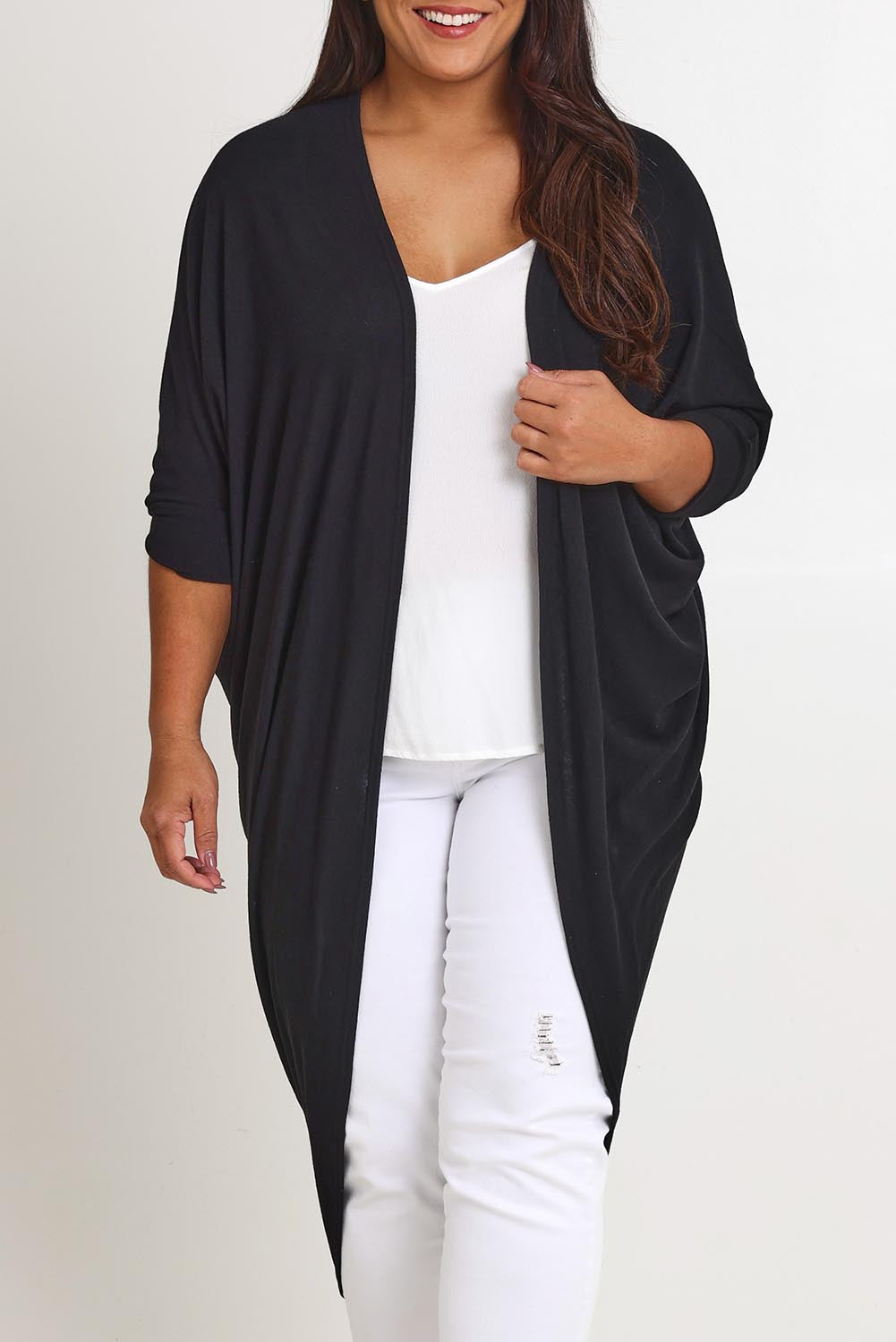 Model Ashleigh wearing size 16 of the Falling For You Cardi in colour Black (Black), from the front, cropped image