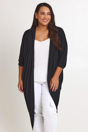 Model Ashleigh wearing size 16 of the Falling For You Cardi in colour Black (Black), from the front, cropped image