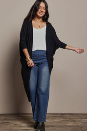 Model Tahnee wearing size 10 of the Falling For You Cardi in colour Black (Black), from the front, showing the whole outfit
