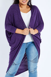 Model Sasha-Lee wearing size 16 of the Falling For You Cardi in colour Grape (Purple), from the front, cropped image