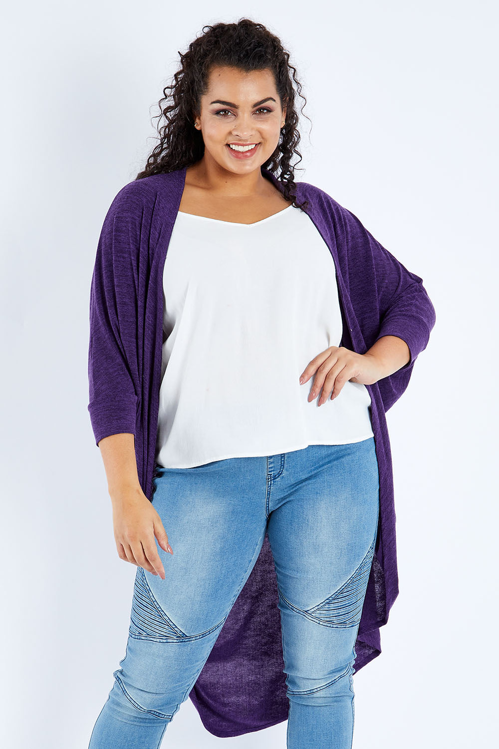 Model Sasha-Lee wearing size 16 of the Falling For You Cardi in colour Grape (Purple), from the front, cropped image