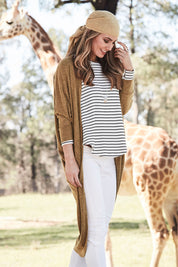 Model Marnee wearing size 10 of the Falling For You Cardi in colour Mustard, from the front, showing the whole outfit