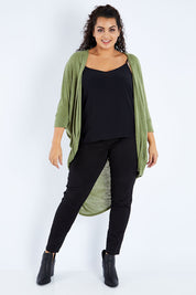 Model Sasha-Lee wearing size 16 of the Falling For You Cardi in colour Olive (Green), from the front, showing the whole outfit